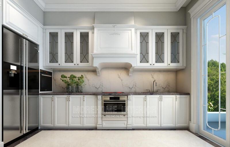 Mẫu tủ bếp tân cổ điển được thiết kế một cách tối giản, các đường nét chi tiết chạm khắc không quá cầu kì mà tập trung vào công năng sử dụng của sản phẩm mang đến một nhà bếp sang trọng mà không bị rối mắt Thiết kế tủ bếp đẹp
